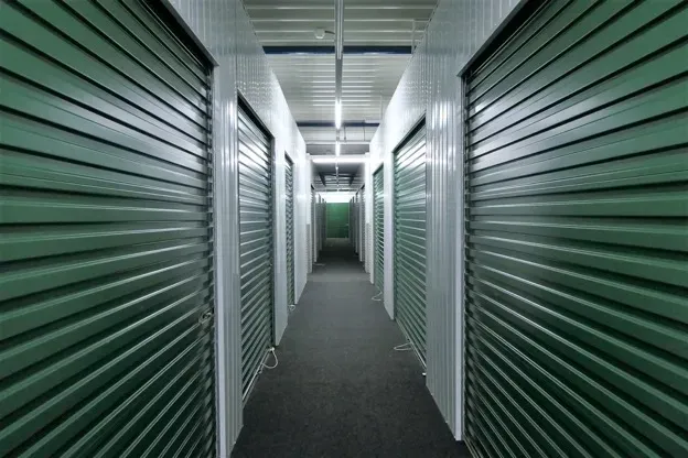 A row of dark green storage units
