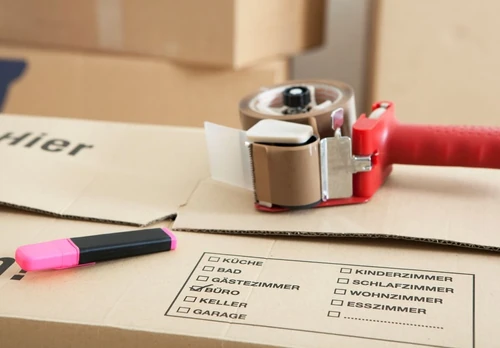 A couple of moving boxes with packaging tape.