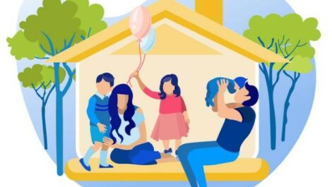 Family of five in a small yellow house with trees around it.