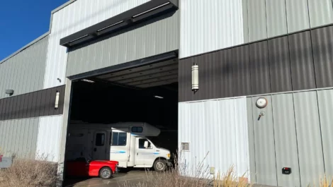 Large indoor garage for storing car, campers, RVs, and boats.