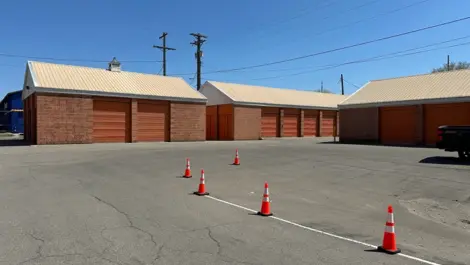 Exterior view of the Five Star Storage facility in St. Paul, showing the electronic gate access point with a keypad for secure entry and exit.