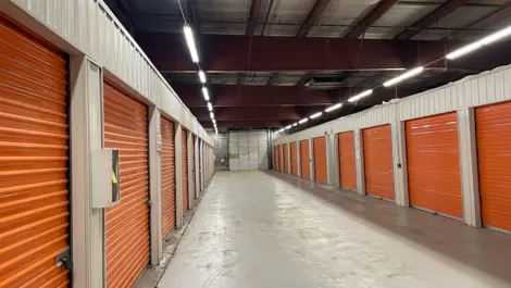 Customer using a moving cart at Five Star Storage - Marshall Ave to transport belongings.